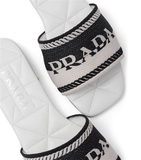 prada embroidered fabric slides.